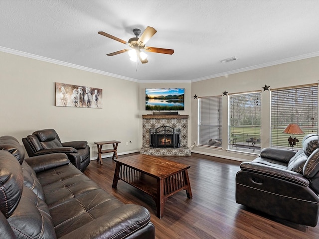 247 Private Road 635, Dayton, TX 77535 - living area with crown molding, dark wood finished floors, a fireplace, and ceiling fan