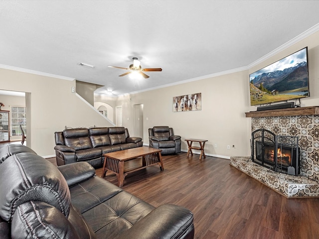 247 Private Road 635, Dayton, TX 77535 - living room with dark wood-style flooring, ceiling fan, crown molding, and a fireplace