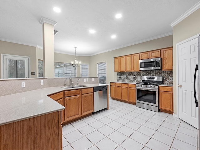247 Private Road 635, Dayton, TX 77535 - kitchen featuring appliances with stainless steel finishes, tasteful backsplash, a peninsula, a chandelier, and recessed lighting