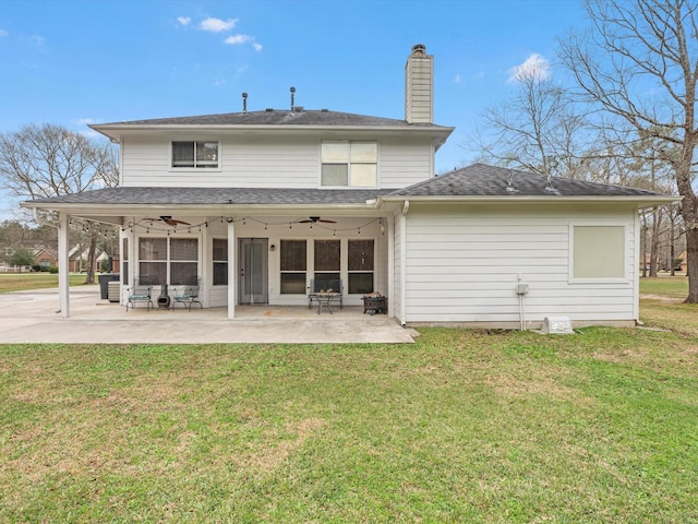 247 Private Road 635, Dayton, TX 77535 - back of house with ceiling fan, a patio area, a yard, and a chimney