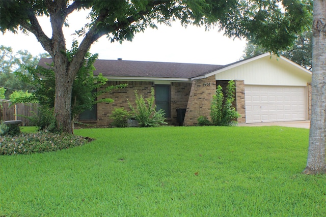 1408 Brandon Ct, Bay City, TX 77414 - ranch-style home with a garage, a front lawn, brick siding, and concrete driveway