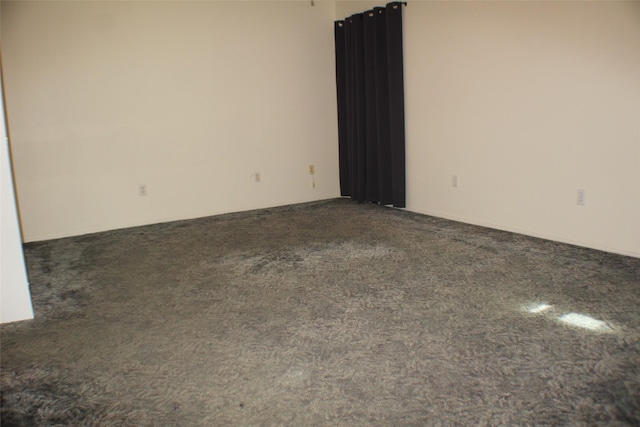 1408 Brandon Ct, Bay City, TX 77414 - empty room featuring dark carpet