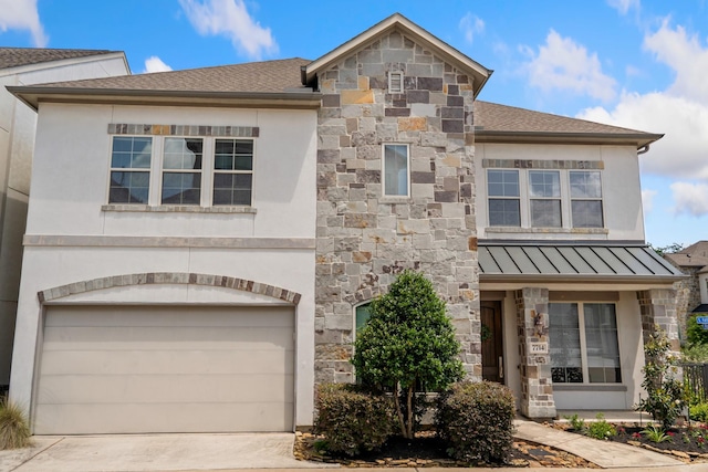 7714 S Fall Run Xing, Houston, TX 77055 - view of front of house featuring stone siding, a standing seam roof, a garage, stucco siding, and concrete driveway
