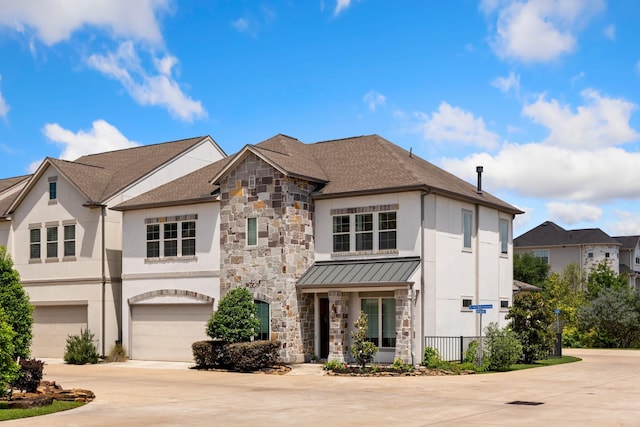 7714 S Fall Run Xing, Houston, TX 77055 - french country inspired facade with driveway, a garage, stucco siding, and a standing seam roof