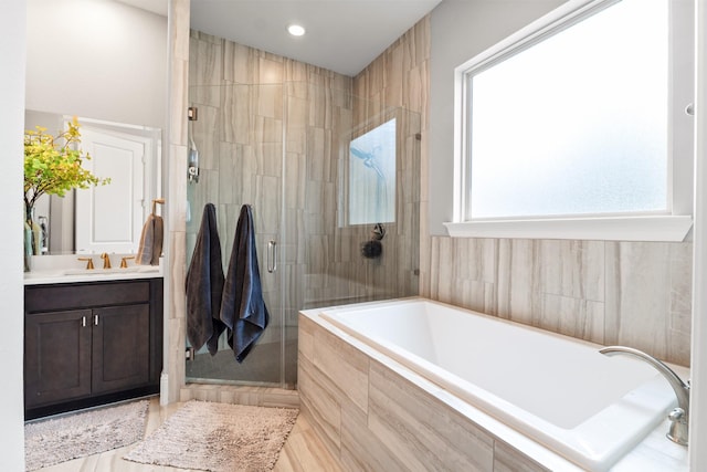7714 S Fall Run Xing, Houston, TX 77055 - bathroom with a garden tub, a shower stall, vanity, and recessed lighting