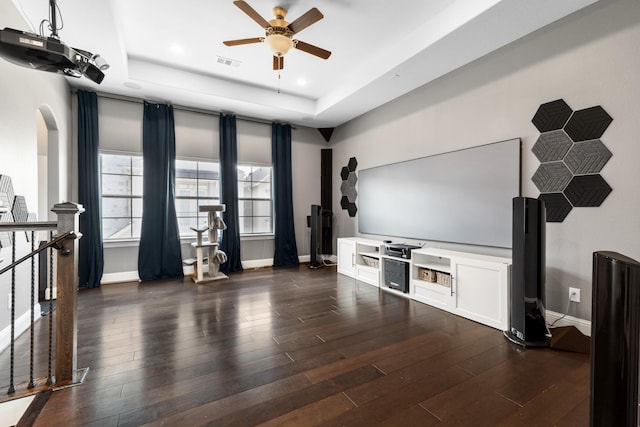 7714 S Fall Run Xing, Houston, TX 77055 - unfurnished living room with a tray ceiling, ceiling fan, dark wood finished floors, recessed lighting, and arched walkways