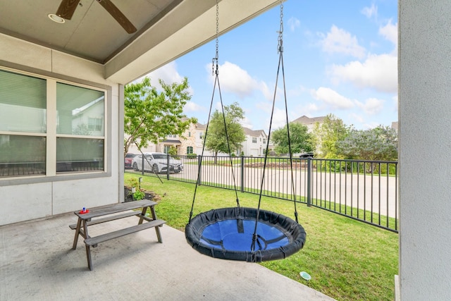 7714 S Fall Run Xing, Houston, TX 77055 - fenced backyard with a ceiling fan, a swimming pool, a residential view, and a patio area