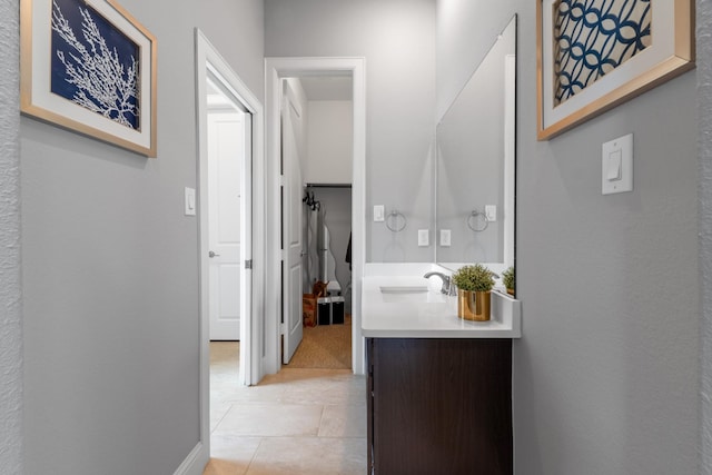 7714 S Fall Run Xing, Houston, TX 77055 - corridor featuring a sink and light tile patterned floors
