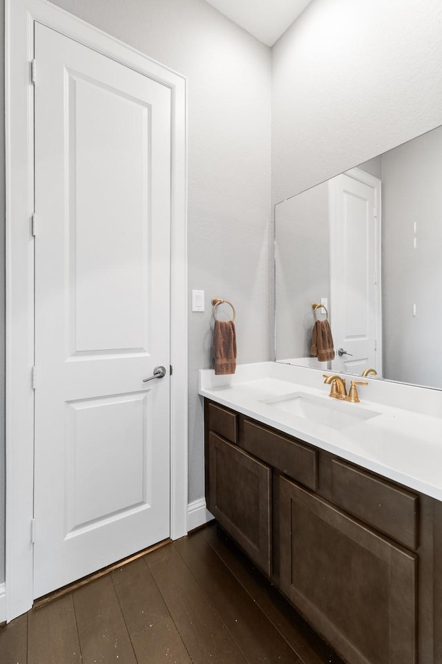 7714 S Fall Run Xing, Houston, TX 77055 - bathroom with vanity and wood finished floors