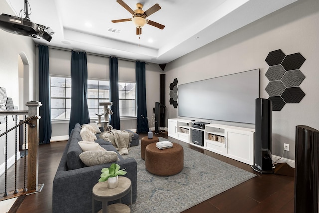 7714 S Fall Run Xing, Houston, TX 77055 - living area with a tray ceiling, a ceiling fan, dark wood finished floors, recessed lighting, and arched walkways