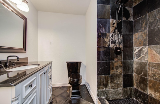 14507 Louetta Rd, Cypress, TX 77429 - full bathroom with vanity, tiled shower, and stone finish flooring