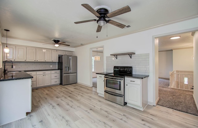 14507 Louetta Rd, Cypress, TX 77429 - kitchen featuring stainless steel appliances, decorative backsplash, ceiling fan, pendant lighting, and crown molding