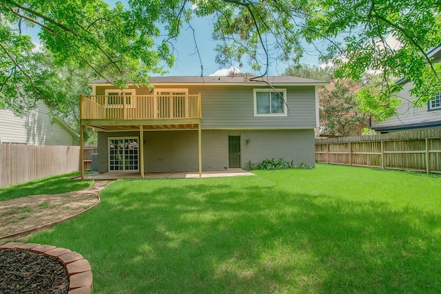 14507 Louetta Rd, Cypress, TX 77429 - rear view of property featuring a fenced backyard, a balcony, a patio, and brick siding