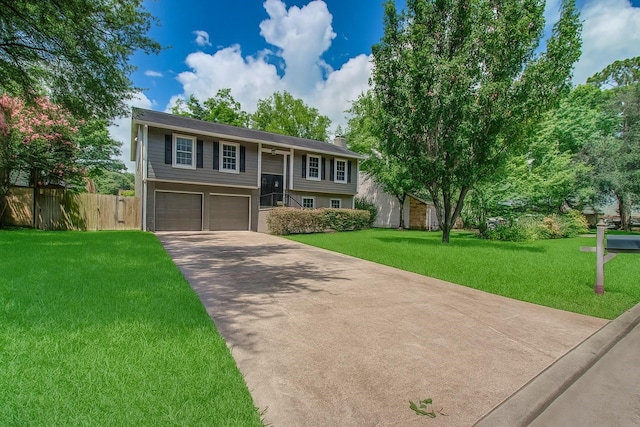 14507 Louetta Rd, Cypress, TX 77429 - split foyer home with concrete driveway, an attached garage, and a chimney