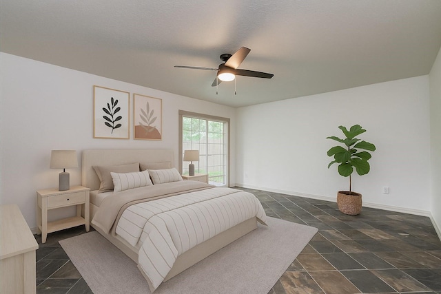 14507 Louetta Rd, Cypress, TX 77429 - bedroom featuring dark stone finish flooring and ceiling fan