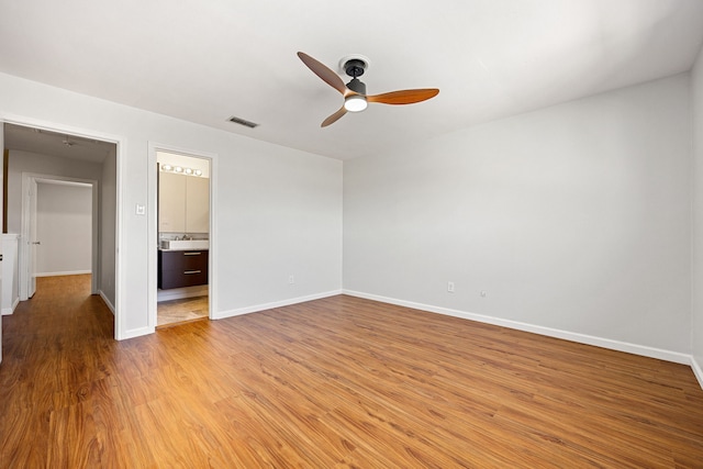 10328 Longmont Dr Unit 47/1, Houston, TX 77042 - unfurnished room featuring ceiling fan and light wood-style floors