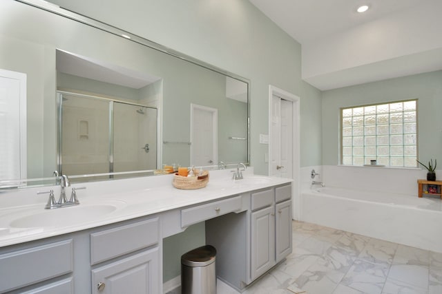 2808 Apache St, League City, TX 77573 - full bathroom with double vanity, a bath, marble look tile flooring, a stall shower, and recessed lighting