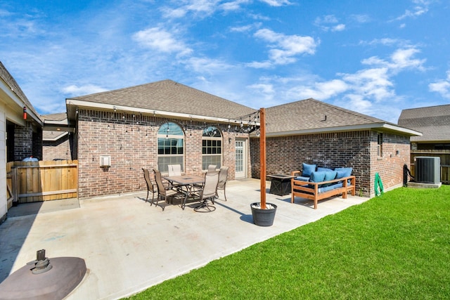 2808 Apache St, League City, TX 77573 - back of property with brick siding, an outdoor hangout area, roof with shingles, and a patio