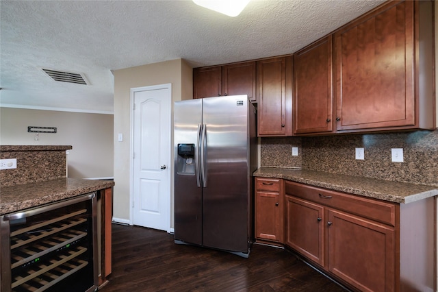 18110 Rexine Ln, Cypress, TX 77433 - kitchen featuring stainless steel fridge, wine cooler, dark countertops, dark wood-style flooring, and a textured ceiling