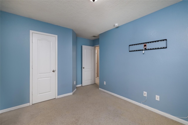 18110 Rexine Ln, Cypress, TX 77433 - unfurnished bedroom featuring carpet flooring and a textured ceiling