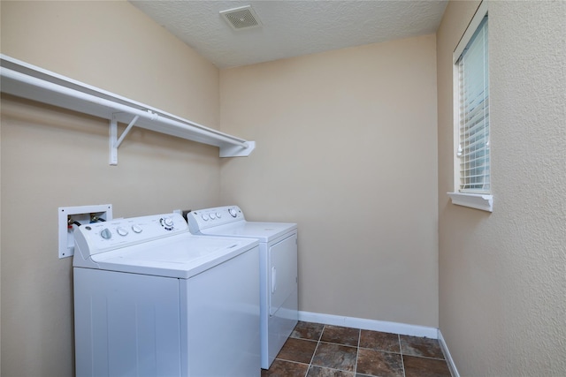 18110 Rexine Ln, Cypress, TX 77433 - laundry room featuring independent washer and dryer and a textured ceiling
