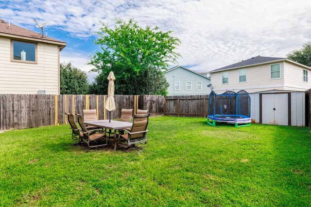 18110 Rexine Ln, Cypress, TX 77433 - fenced backyard with a storage shed and a trampoline
