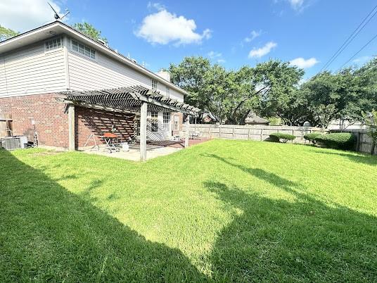 1631 Almond Brook Ln, Houston, TX 77062 - fenced backyard with a pergola and a patio area