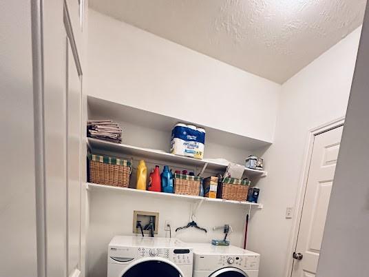 1631 Almond Brook Ln, Houston, TX 77062 - laundry room with separate washer and dryer and a textured ceiling