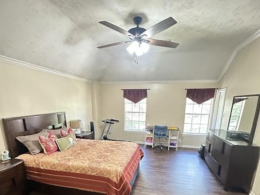 1631 Almond Brook Ln, Houston, TX 77062 - bedroom with vaulted ceiling, crown molding, dark wood finished floors, a ceiling fan, and a textured ceiling