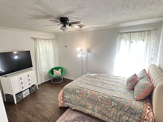 1631 Almond Brook Ln, Houston, TX 77062 - bedroom featuring a textured ceiling, wood finished floors, crown molding, and ceiling fan