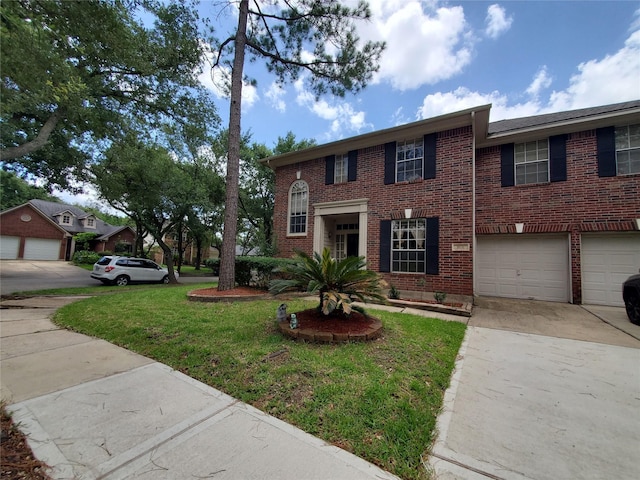 1631 Almond Brook Ln, Houston, TX 77062 - view of front of house with driveway, a front lawn, and brick siding