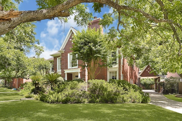 6102 Walkers Park Dr, Sugar Land, TX 77479 - view of front of home with brick siding and a chimney