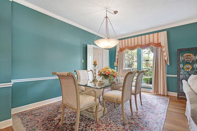 6102 Walkers Park Dr, Sugar Land, TX 77479 - dining room featuring ornamental molding and wood finished floors