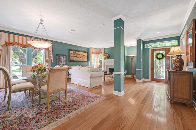 6102 Walkers Park Dr, Sugar Land, TX 77479 - dining space with crown molding, plenty of natural light, hardwood / wood-style flooring, and a textured ceiling