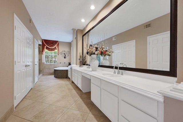 6102 Walkers Park Dr, Sugar Land, TX 77479 - bathroom with double vanity, tile patterned floors, a soaking tub, and a shower with door