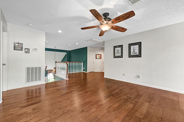6102 Walkers Park Dr, Sugar Land, TX 77479 - unfurnished living room featuring ceiling fan, wood finished floors, a textured ceiling, attic access, and recessed lighting