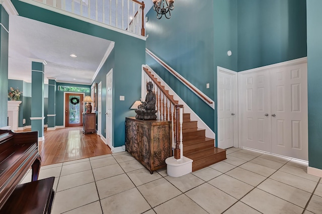 6102 Walkers Park Dr, Sugar Land, TX 77479 - foyer featuring a high ceiling, tile patterned floors, stairs, a chandelier, and recessed lighting