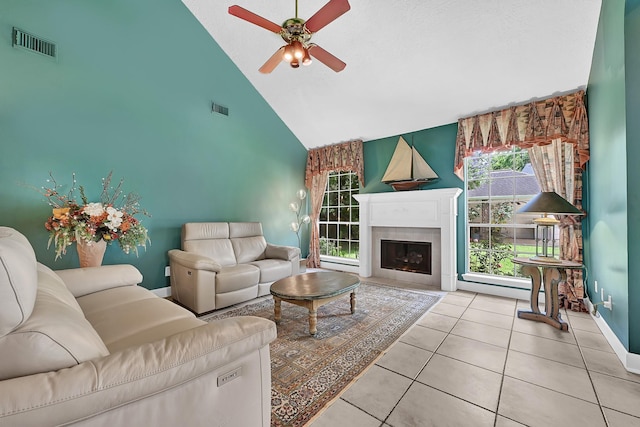 6102 Walkers Park Dr, Sugar Land, TX 77479 - living room featuring high vaulted ceiling, ceiling fan, tile patterned flooring, and a fireplace