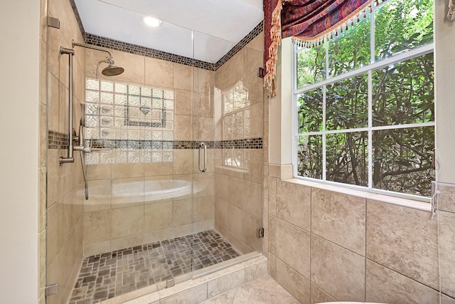 6102 Walkers Park Dr, Sugar Land, TX 77479 - bathroom featuring a stall shower and tile walls