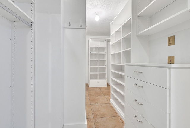 6102 Walkers Park Dr, Sugar Land, TX 77479 - walk in closet featuring light tile patterned flooring