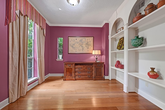 6102 Walkers Park Dr, Sugar Land, TX 77479 - office space with a textured ceiling, hardwood / wood-style floors, ornamental molding, and built in features