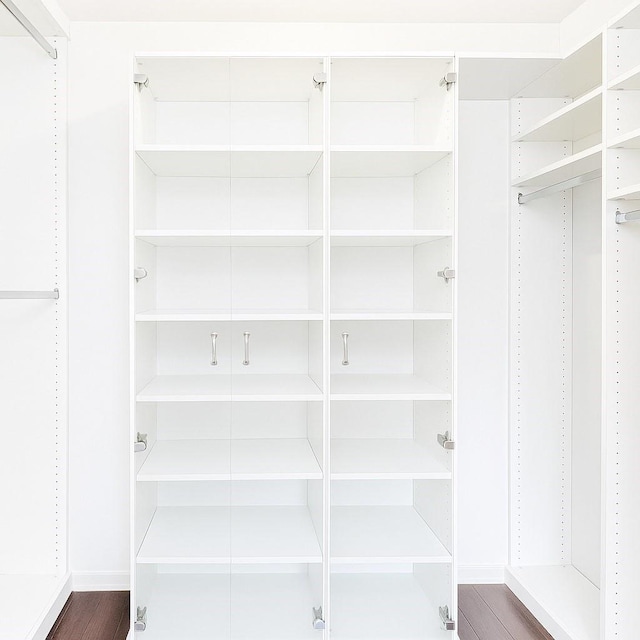 6102 Walkers Park Dr, Sugar Land, TX 77479 - walk in closet with wood finished floors