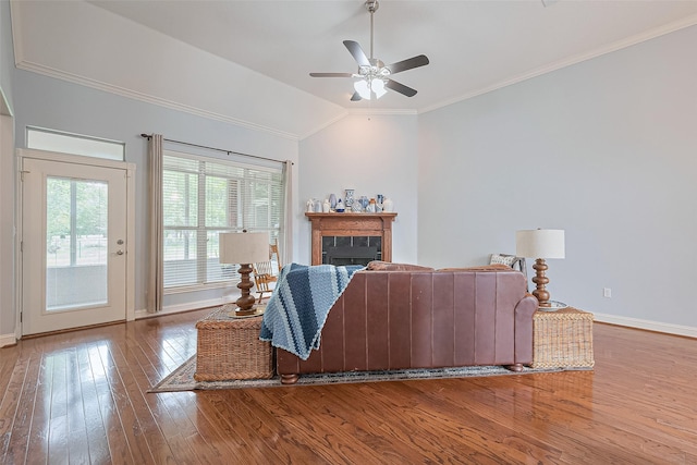 13820 Midway Dr, Willis, TX 77318 - living room with hardwood / wood-style flooring, lofted ceiling, ceiling fan, ornamental molding, and a fireplace