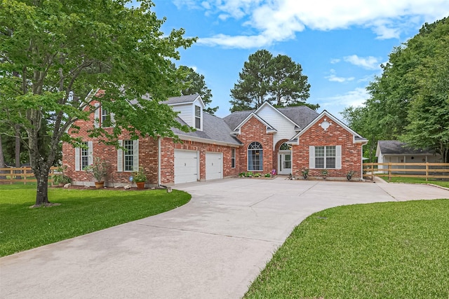 13820 Midway Dr, Willis, TX 77318 - traditional home featuring driveway, brick siding, a garage, and a shingled roof