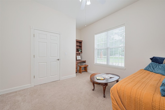 13820 Midway Dr, Willis, TX 77318 - living area featuring light carpet and a ceiling fan