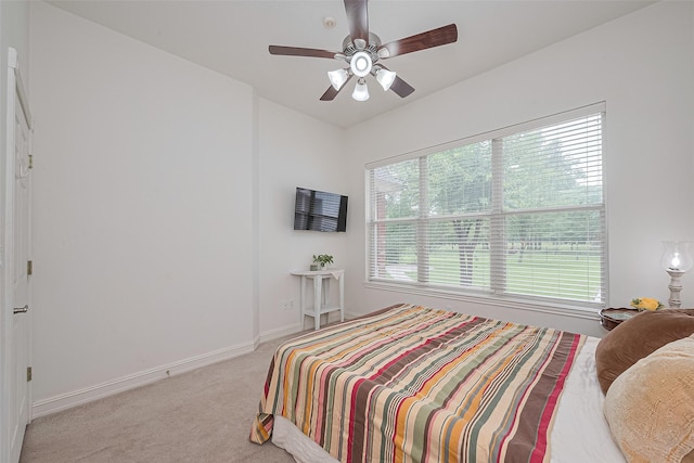 13820 Midway Dr, Willis, TX 77318 - bedroom with light colored carpet and ceiling fan