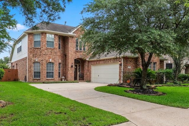 3318 Legends Mist Dr, Spring, TX 77386 - view of front facade with brick siding, a garage, driveway, and a shingled roof