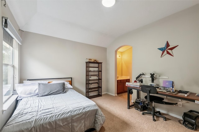 3318 Legends Mist Dr, Spring, TX 77386 - bedroom featuring lofted ceiling, light colored carpet, arched walkways, an office area, and connected bathroom