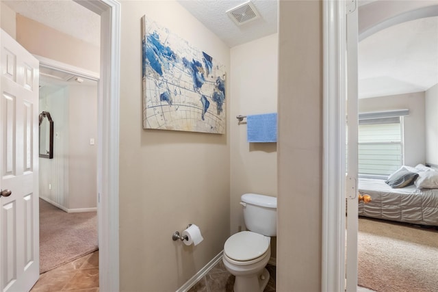3318 Legends Mist Dr, Spring, TX 77386 - ensuite bathroom with toilet and baseboards