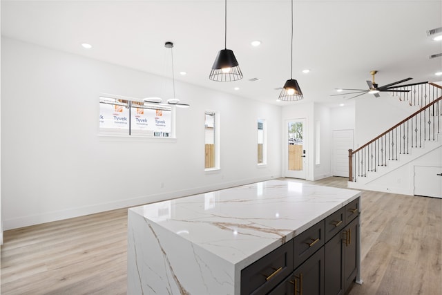 3524 Rebecca St, Houston, TX 77021 - kitchen featuring light wood-style floors, recessed lighting, decorative light fixtures, a center island, and a ceiling fan